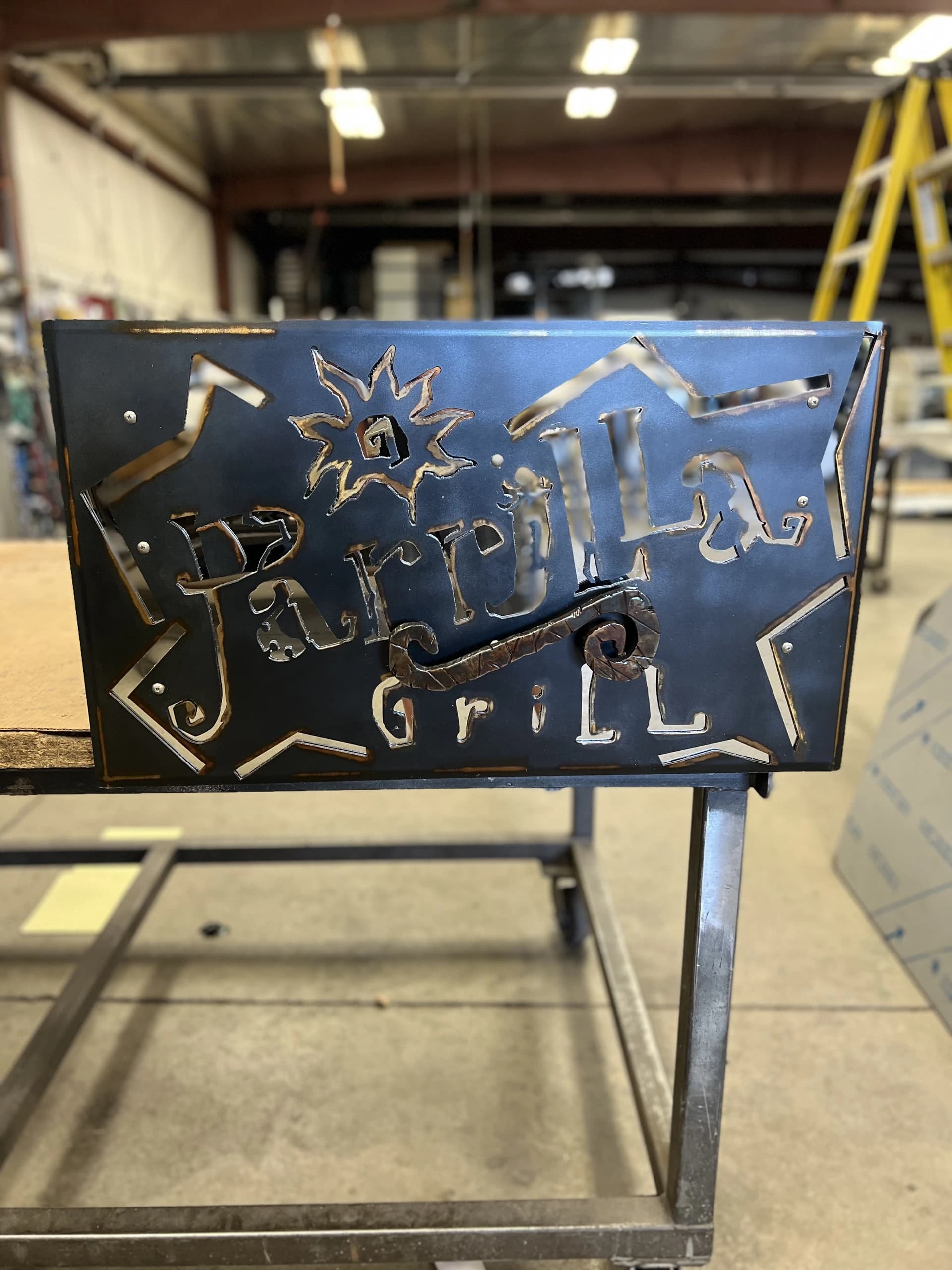 laser cut steel sign ornamental sheet metal fabrication shop workpiece